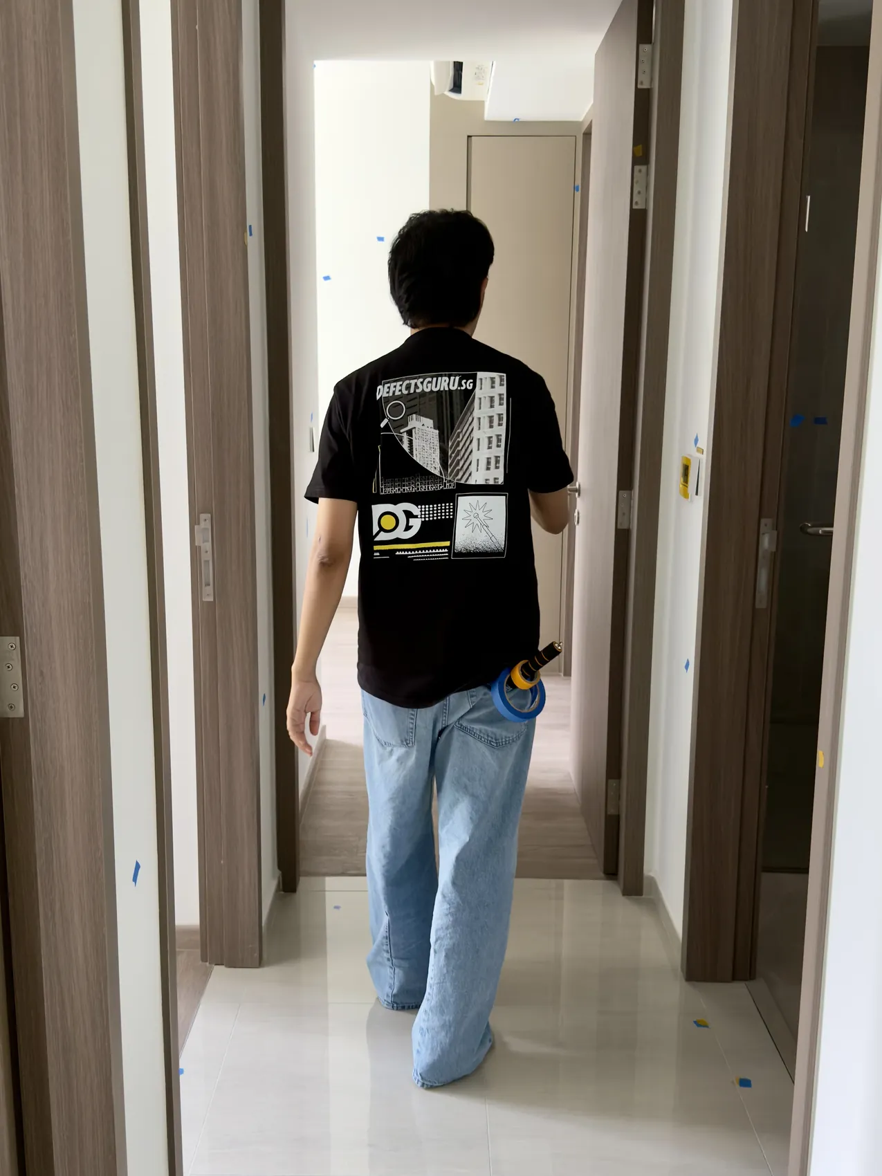 A DefectsGuru inspector walking through a new home during a handover inspection
